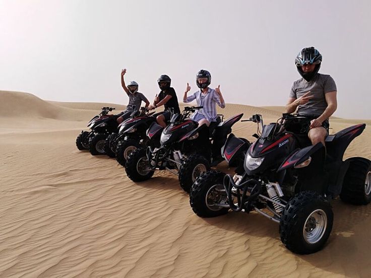 Enjoying quad bike and ATV safari tour in Dubai with Friends