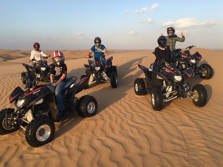Family enjoying guided UTV rental in Dubai dunes