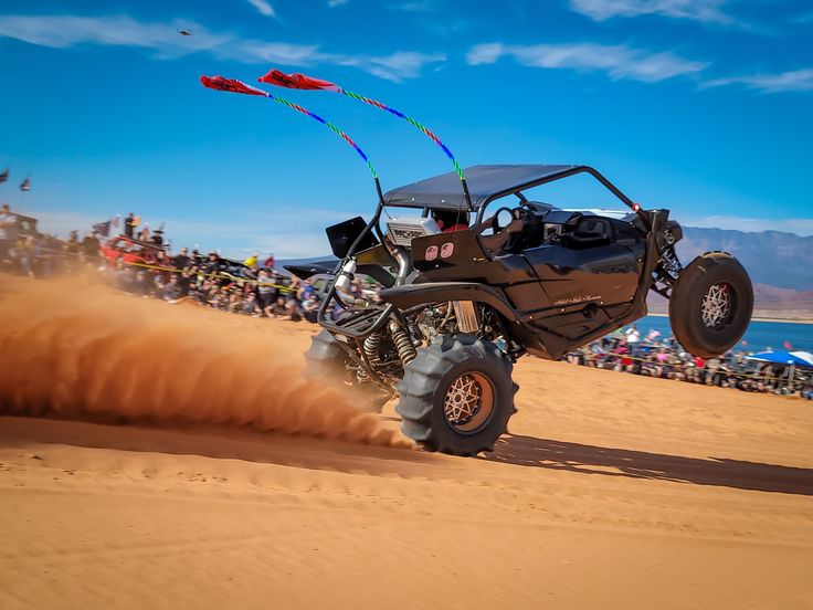 Riding a rented quad bike across Dubai’s golden sand dunes